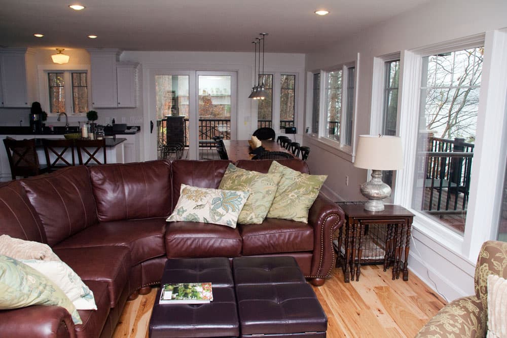 Open concept living room, dining area, and kitchen with lake view
